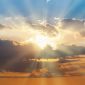 Blue and orange sunset sky with rays of sun. Natural landscape for background